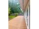 Wide wood deck that overlooks a green yard and a privacy fence at 532 Madison Ave, Orlando, FL 32805