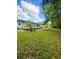 Mature trees frame the expansive backyard and deck, perfect for outdoor entertaining at 532 Madison Ave, Orlando, FL 32805