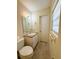 Well-lit bathroom featuring a single sink vanity, tile floors, and a linen closet at 532 Madison Ave, Orlando, FL 32805