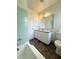 Bathroom with a tub, a toilet, and a vanity with storage at 532 Madison Ave, Orlando, FL 32805