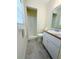 Bathroom featuring a shower stall, a single sink vanity, and tile flooring at 532 Madison Ave, Orlando, FL 32805