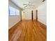 Bright bedroom featuring natural light, a ceiling fan, hardwood floors, and two closets at 532 Madison Ave, Orlando, FL 32805