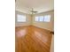 Bright bedroom featuring natural light, a ceiling fan, and sleek hardwood floors at 532 Madison Ave, Orlando, FL 32805