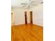 Bedroom featuring natural light, a ceiling fan, hardwood floors, and a walk-in closet at 532 Madison Ave, Orlando, FL 32805