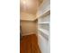 Walk-in closet with custom shelving and wood floors at 532 Madison Ave, Orlando, FL 32805