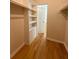 Walk-in closet with custom shelving and wood floors at 532 Madison Ave, Orlando, FL 32805