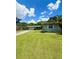 Ranch-style home with well-maintained lawn, simple landscaping, and a visible two-car garage at 532 Madison Ave, Orlando, FL 32805