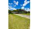 Ranch-style home with a spacious front yard and long driveway leading to a two-car garage at 532 Madison Ave, Orlando, FL 32805