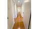 Long hallway featuring hardwood floors and neutral paint at 532 Madison Ave, Orlando, FL 32805