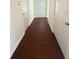 Hallway features a tiled floor, white doors, and neutral paint, with a front door at the end of the hall at 532 Madison Ave, Orlando, FL 32805