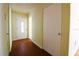 Hallway showcasing the front door and a neutral color scheme throughout at 532 Madison Ave, Orlando, FL 32805