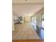 Open-concept living area featuring tile floors, a modern kitchen, and sliding glass doors for natural light at 532 Madison Ave, Orlando, FL 32805
