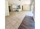 Bright living area with tile and wood floors, an open kitchen, and sliding doors offer seamless indoor-outdoor living at 532 Madison Ave, Orlando, FL 32805