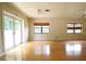Bright living room with hardwood floors, natural light, and a ceiling fan at 532 Madison Ave, Orlando, FL 32805