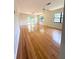 Spacious living room showcasing hardwood floors, dual ceiling fans, and natural light at 532 Madison Ave, Orlando, FL 32805