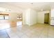 Open-concept living area with tile flooring, natural light, and hardwood flooring beyond at 532 Madison Ave, Orlando, FL 32805
