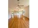 Bright living room featuring hardwood floors, ceiling fans, and French doors to the exterior at 532 Madison Ave, Orlando, FL 32805