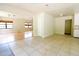 Expansive living space with hardwood flooring and tile adjoining rooms, creating a seamless transition between living areas at 532 Madison Ave, Orlando, FL 32805
