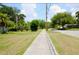 Street view shows a sidewalk near a grassy area with trees, powerlines, and an American flag at 532 Madison Ave, Orlando, FL 32805