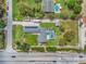 Overhead shot of property with pool, RV parking, and solar panels on a large lot at 5800 Spruce Creek Woods Dr, Port Orange, FL 32127