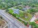 Aerial view of the neighborhood featuring lush tree coverage, pool, and RV parking at 5800 Spruce Creek Woods Dr, Port Orange, FL 32127