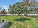 Expansive backyard featuring a custom treehouse and swing, perfect for outdoor fun and relaxation at 5800 Spruce Creek Woods Dr, Port Orange, FL 32127