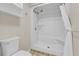Close-up of a clean and well-maintained shower-tub, featuring tile flooring and neutral walls at 5800 Spruce Creek Woods Dr, Port Orange, FL 32127