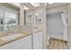 Clean bathroom featuring a tiled floor, white cabinets, and a shower-tub combination at 5800 Spruce Creek Woods Dr, Port Orange, FL 32127