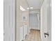 Bright bathroom with white cabinetry, a single sink vanity, and a shower-tub combination at 5800 Spruce Creek Woods Dr, Port Orange, FL 32127
