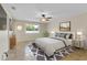 Beautifully staged bedroom with stylish furniture, decor, and a neutral color palette at 5800 Spruce Creek Woods Dr, Port Orange, FL 32127