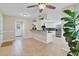 View of the kitchen with stainless steel appliances and stylish white cabinets and tile flooring at 5800 Spruce Creek Woods Dr, Port Orange, FL 32127