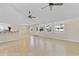 Open living room features tile floors, neutral paint, many windows and bright natural light at 5800 Spruce Creek Woods Dr, Port Orange, FL 32127
