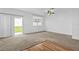 Clean and simple bedroom with natural light streaming through the window at 597 Madison Dr, Davenport, FL 33837