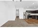 Bright and open living area with a view into the modern kitchen at 597 Madison Dr, Davenport, FL 33837