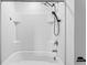 Clean white shower-tub combo with modern shower head fixture, and white tiled surround at 597 Madison Dr, Davenport, FL 33837