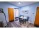 Cozy dining area with a small table and chairs, adjacent to the living room at 620 E Church Ave, Longwood, FL 32750