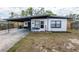 Charming single-story home with a carport and freshly painted exterior at 620 E Church Ave, Longwood, FL 32750