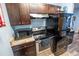 Galley-style kitchen features black appliances and plenty of storage at 620 E Church Ave, Longwood, FL 32750