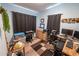 Office featuring light blue walls, a wooden dresser, and two separate desk areas at 620 E Church Ave, Longwood, FL 32750