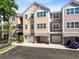 Beautiful three-story townhome featuring an attached two car garage and neutral paint colors at 6685 Queens Borough Ave # 202, Orlando, FL 32835