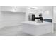 Open kitchen area with modern appliances, sleek countertops and bright lighting at 6685 Queens Borough Ave # 202, Orlando, FL 32835