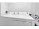 White washer and dryer in a dedicated laundry space; functional and ready for use at 6685 Queens Borough Ave # 202, Orlando, FL 32835