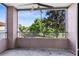 Relaxing screened patio with ceiling fan and views of lush green trees and landscaping at 6685 Queens Borough Ave # 202, Orlando, FL 32835