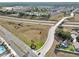 A beautiful aerial view showcasing the community's convenient access to the highway and nearby amenities at 8118 Fan Palm Way, Kissimmee, FL 34747