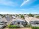 Aerial view of a backyard with a screened-in pool and green landscaping in a residential area at 8118 Fan Palm Way, Kissimmee, FL 34747
