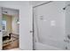 Bathroom featuring a shower and a view into the Primary bedroom at 8118 Fan Palm Way, Kissimmee, FL 34747