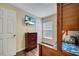 Neutral-toned bedroom featuring a dresser, TV, and bunkbed with a ladder at 8118 Fan Palm Way, Kissimmee, FL 34747
