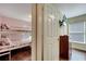 Bedroom with bunkbeds, wood floors, and a wall-mounted TV at 8118 Fan Palm Way, Kissimmee, FL 34747