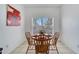 Cozy dining area featuring a round table for four, perfect for intimate meals at 8118 Fan Palm Way, Kissimmee, FL 34747