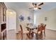 Formal dining space features a glass table with seating for six at 8118 Fan Palm Way, Kissimmee, FL 34747